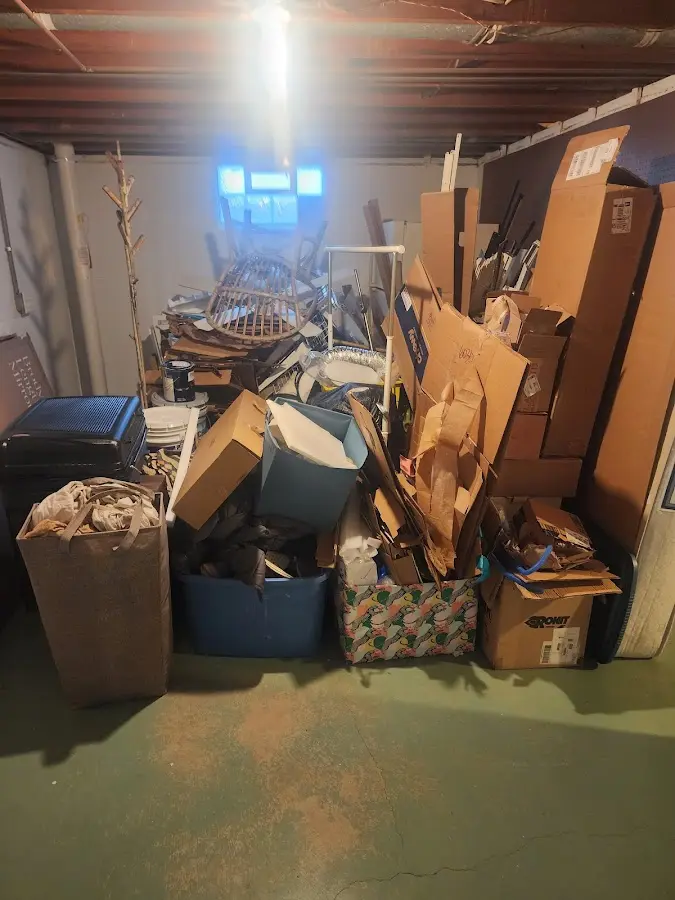 Roll-off dumpster container at job site for 2 Yard Dumpster Rental in Clay